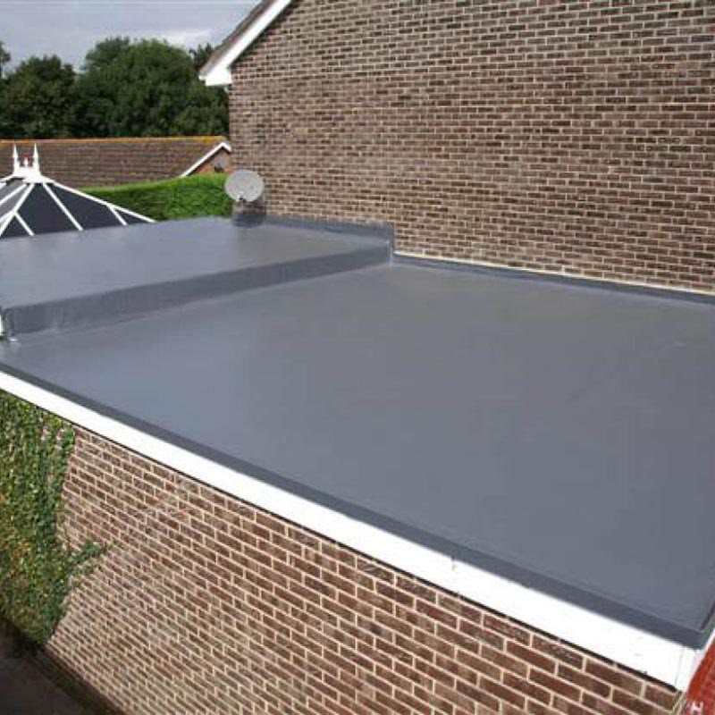 Completed grey flat roof with parapet and rooflight detail