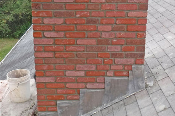 Roof repair work showing tile and batten repair